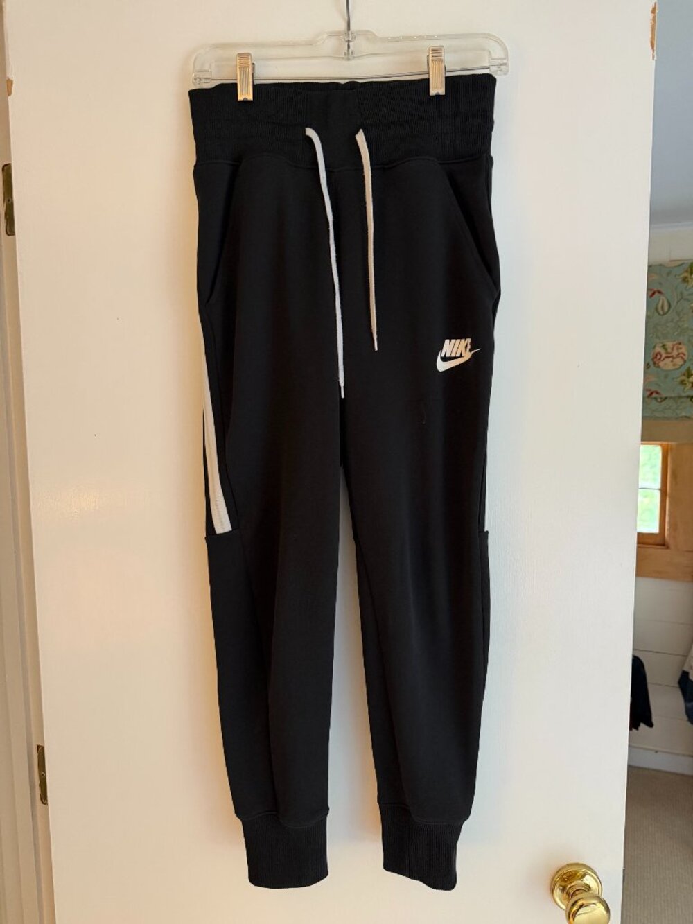 Nike: Athletic joggers in black with a white side stripe: Size: S